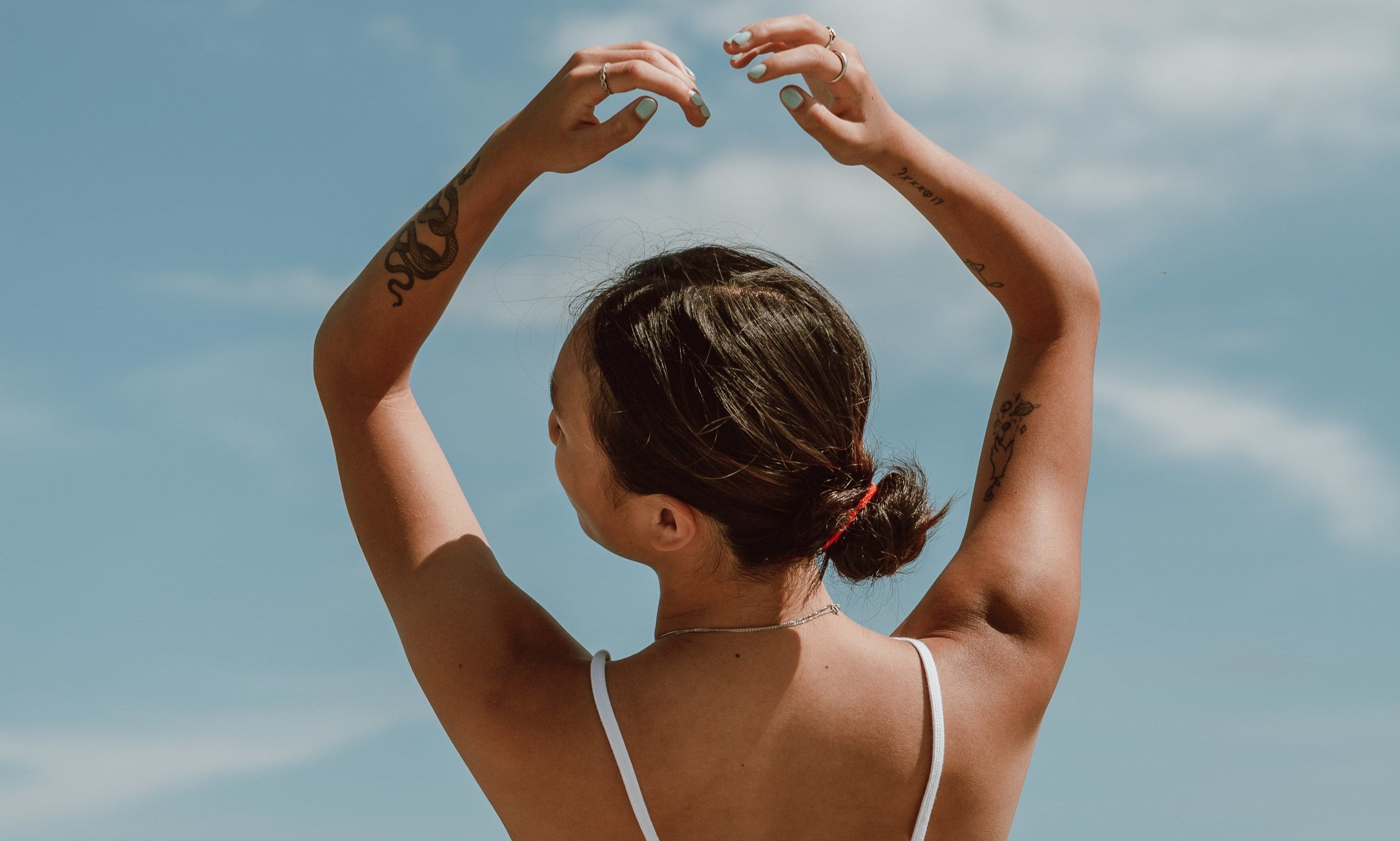 person-poses-in-front-of-water